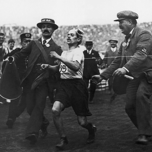 The arrival of Dorando Pietri at the finish of the 1908 Olympics marathon.